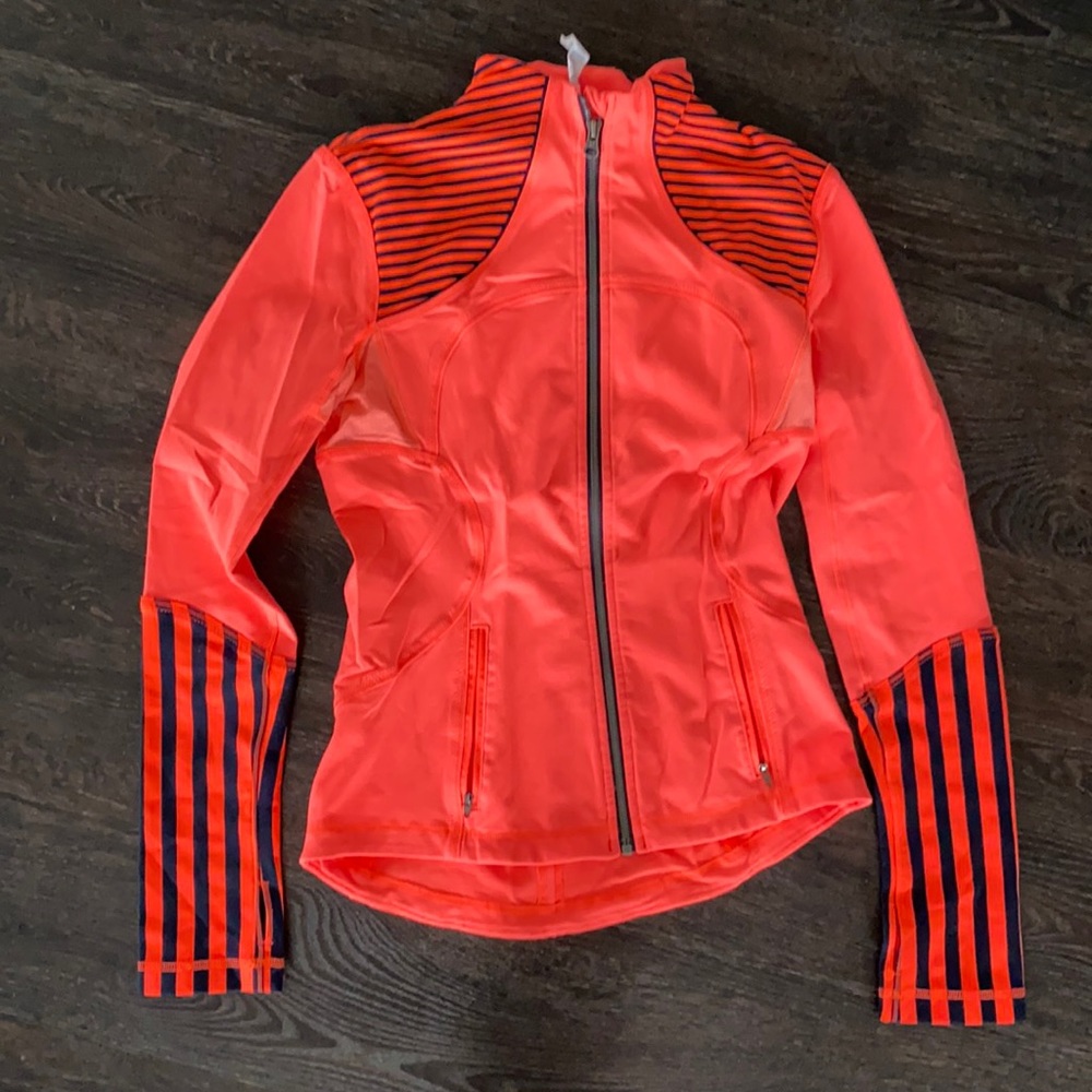 Lululemon jacket in neon orange.  Size 6.